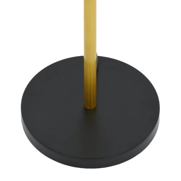 Metal rounded black base of a golden floor light globostar